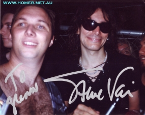 Steve Vai and Homer. It was a real honour to have a picture taken with one of the best guitarists on the planet.............and Homer was honoured too!!